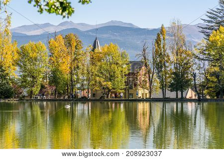 Autumn colors and reflection on Puigcerda's pond in Pyrenees. Located in north Catalonia, Spain.
