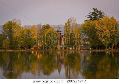 Autumn colors and reflection on Puigcerda's pond in Pyrenees. Located in north Catalonia, Spain.