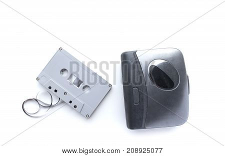 Old cassette player and cassette tape isolated on white background