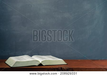 Bible on an old table. Beautiful background.Religion concept.