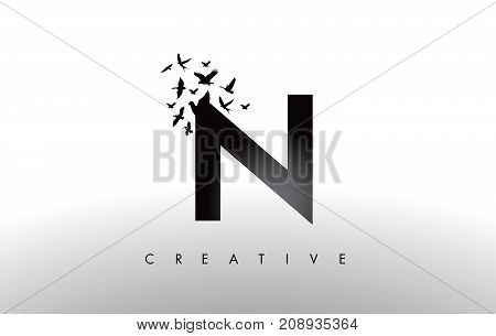 N Logo Letter With Flock Of Birds Flying And Disintegrating From The Letter.