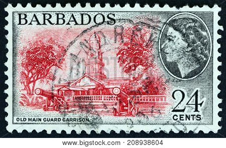 BARBADOS - CIRCA 1953: A stamp printed in Barbados shows Old Main Guard Garrison and Queen Elizabeth II, circa 1953.