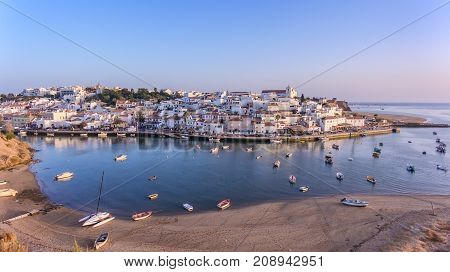 Aerial. Ferragudo at sunset shooting from the sky with drone.
