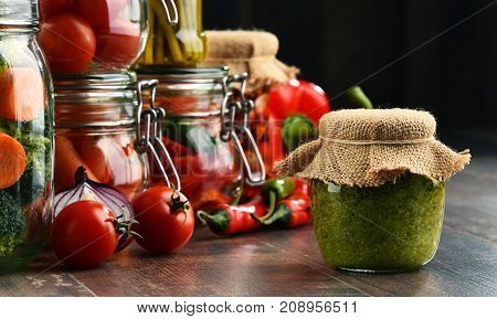 Jars With Marinated Food And Organic Raw Vegetables