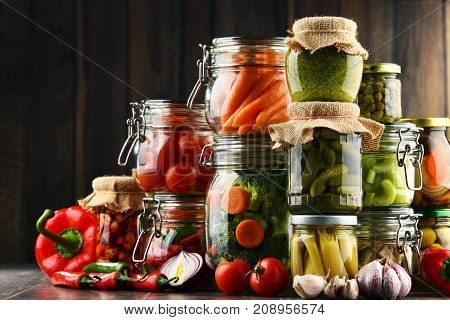 Jars With Marinated Food And Organic Raw Vegetables