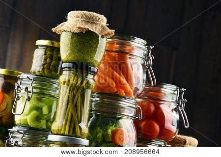 Jars With Marinated Food And Organic Raw Vegetables