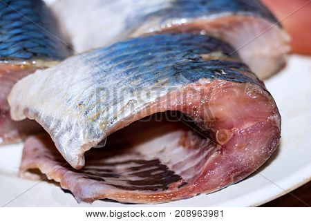 Pieces of fish, Pieces of herring on the plate. Selective focus