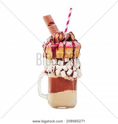 Chocolate and donuts extreme milkshake with marshmallow and other sweets in mason jar isolated on white. Crazy freakshake isolated on white with clipping path