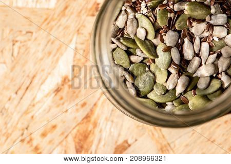 mason jar full of seeds healthy raw food mix of flax sesame pumpkin and sunflower seeds