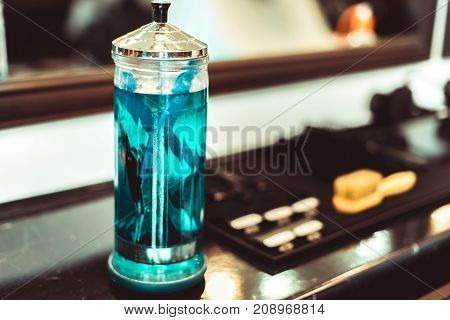The Tools Of A Barber On The Desktop In Front Of The Mirror