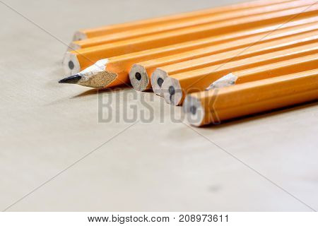 Crayons And Pencil Sharpener On A Wooden Office Table. Crayons With Sharpening Crayons And Pencils O