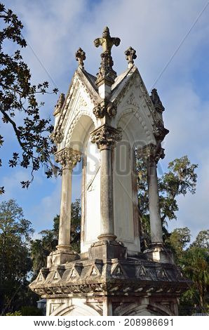 THUNDERBOLT, GA - October 8, 2017 Gothic style memorial column's top stands out in a summer sky at Bonaventure Cemetery.