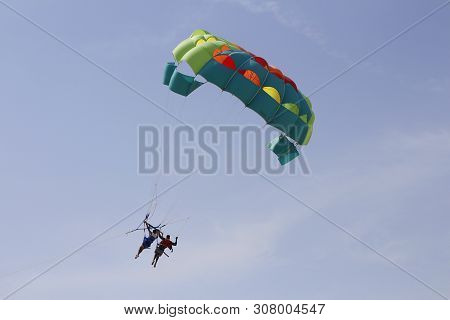 Paraglider With A Saddle For People. Parasales - Water Parachutes. Bright Colours.