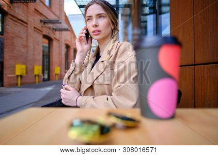 woman using smartphone in caffee shop. smart phone or mobile 