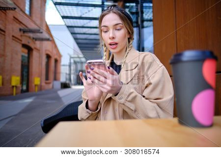 woman using smartphone in caffee shop. smart phone or mobile 