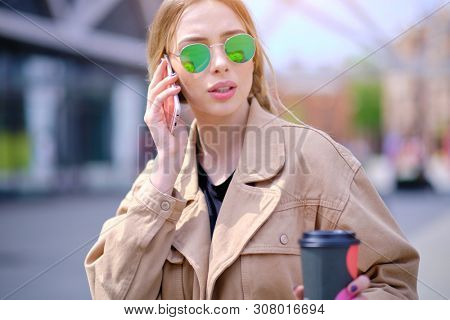 woman using smartphone in caffee shop. smart phone or mobile 