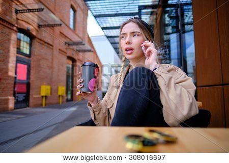 woman using smartphone in caffee shop. smart phone or mobile 