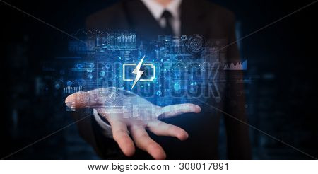 Elegant hand holding battery with full of energy