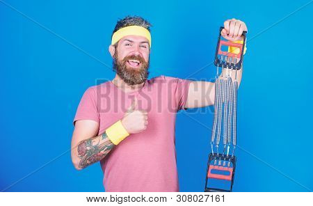 Try Stretching Exercise. Athlete Sport Instructor. Athlete Workout With Expander. Man Bearded Athlet