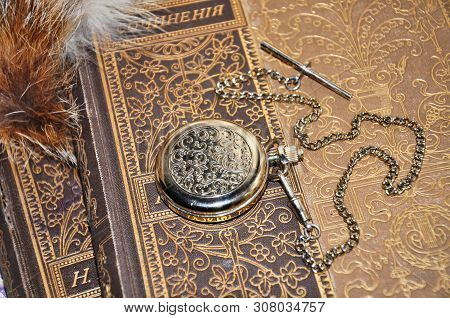 Pocket Watches On A Chain Are On The Old Folio. Floral Pattern On The Watch Case And On The Covers. 