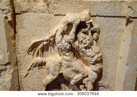 Bas-relief On The Sarcophagus, The Battle Of A Man With A Centaur.
