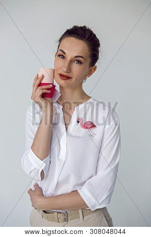 Young Attractive Beautician Aesthetician Woman In White Shirt