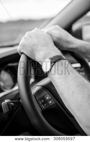Side View Of Adult Male Hands Holding Firmly The Steering Wheel Driving To Destination Vehicle Addap