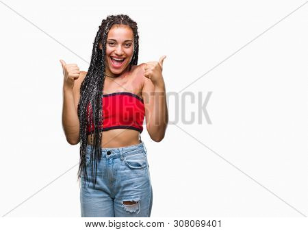 Young braided hair african american with pigmentation blemish birth mark over isolated background success sign doing positive gesture with hand, thumbs up smiling and happy. Looking at the camera 