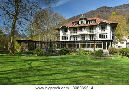 Beautiful House On The Background Of The Alps On A Sunny Spring Day. Weesen, Switzerland.