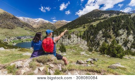 Two Tourist In A Nice Valley In Mountain Pyrenees Of Spain (valley Name Is Vall De Nuria)