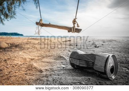 Cans On The Beach Destroy The Environment. Garbage In The Sand On Nature. Trash On On A Beautiful Be