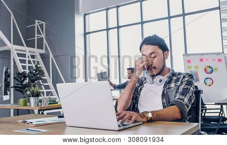 Creative Designer Get Stress While Working With Laptop At Modern Office.workplace Lifesyle Concept