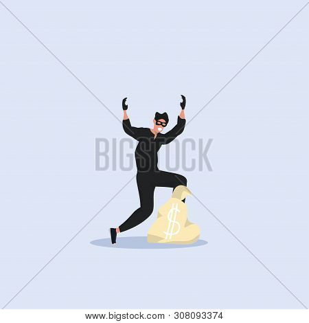 Robber In Black Clothes And Mask Standing With Raised Hands Near Money Bag Detention Of Criminal Con