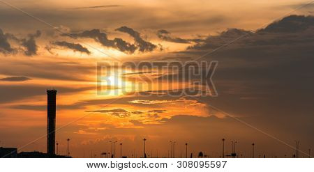 The Plane Arriving At Airport During Sunset