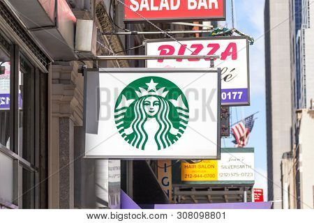 New York, Usa - 16 May, 2019: Starbucks Sign In A Starbucks Restaurant In New York. Starbucks Corpor
