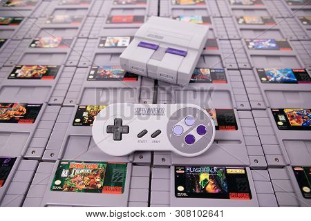 Taipei, Taiwan - June 19, 2019: A Nintendo Nes Mini System And Controller On Top Of A Pile Of Retro 
