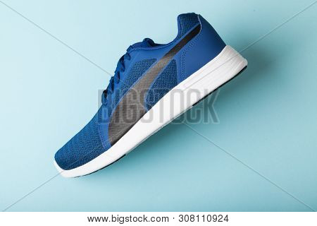 Varna , Bulgaria - April 24, 2019 Puma St Trainer Evo Knit Sport Shoe On Blue Background. Puma Is A 