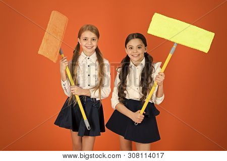 Super Duper Cleaning. Cute Schoolgirls Holding Floor Mops. School Children With Cleaning Tools. Litt