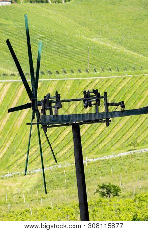 vineyard with windmill called klapotetz in south of Styria, Austria