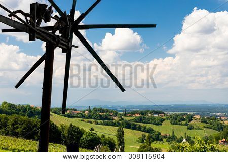 vineyard with windmill called klapotetz in south of Styria, Austria