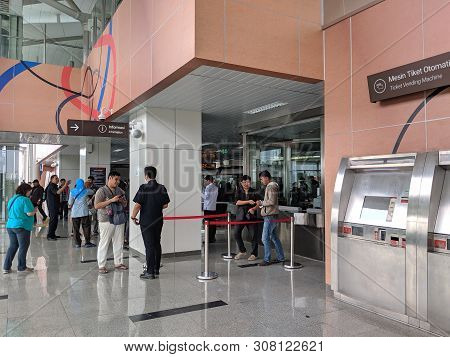 Jakarta, Indonesia - June 17, 2019: People Line Up To Buy Lrt Train Ticket On Ticket Counter At Velo