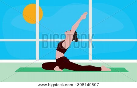 A Young Woman Standing On A Yoga Mat In A Room With A Window In Yoga Pigeon Asana Pada Radzhakapotas