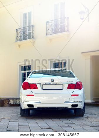 Grodno, Belarus, May 16, 2013: Modern Luxury Bmw 750li Xdrive Car Rear Back View Parked On Stone Pav
