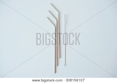 Lot Of Metal Tubes For Cocktails With Schutkoy For Cleaning Isolated On White.
