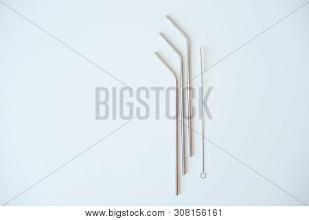 Lot Of Metal Tubes For Cocktails With Schutkoy For Cleaning Isolated On White.