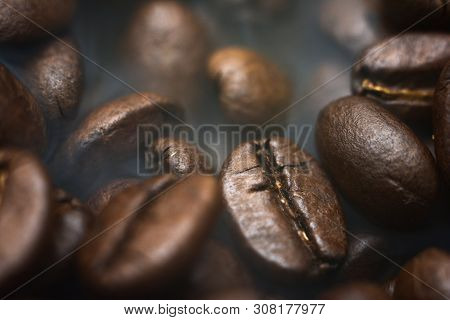 Different Kinds Of Coffee Beans. Coffee Background. Smoke Roasted Coffee Beans.