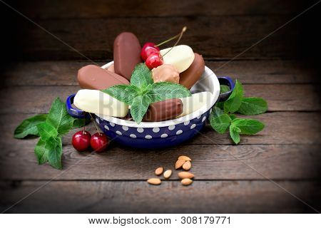 Ice Cream With Vanilla, Caramel, Cherry, Hazelnut And Almond In Hot Suumer Days