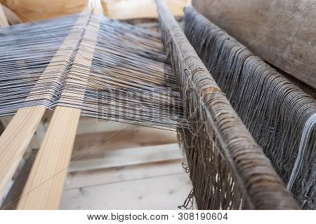 Old Loom. The Production Of Fabrics On An Ancient Machine. Close-up