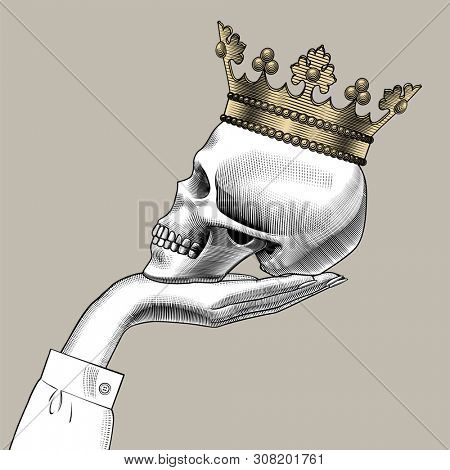 Human skull full face with a gold crown. Vintage engraving stylized drawing. 