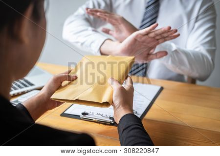 Anti Bribery And Corruption Concept, Business Man Refusing And Don't Receive Money Banknote In Envel